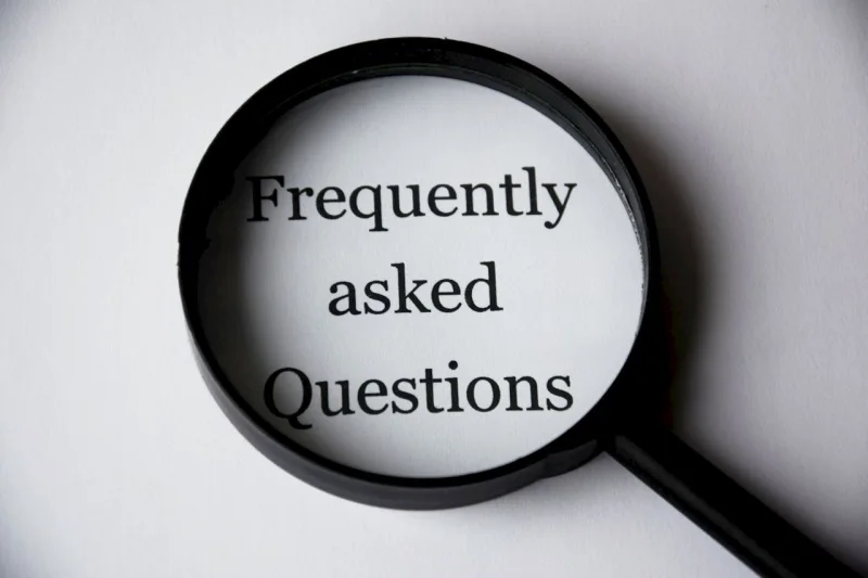 Text "Frequently asked questions" printed on paper