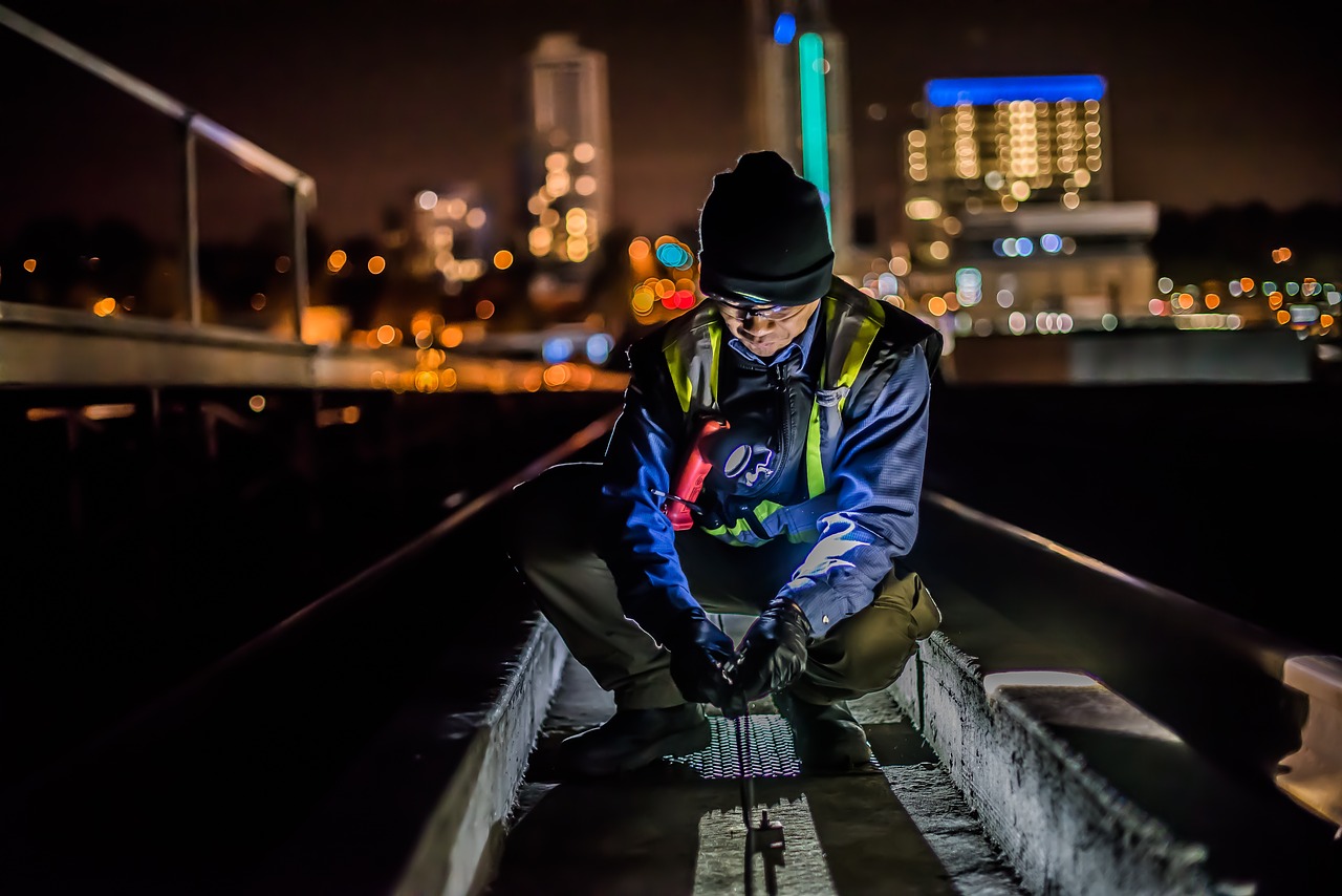 A utility worker performing a cable installation