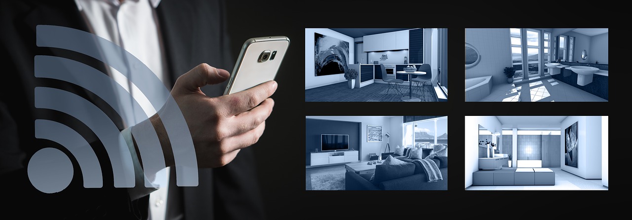 Man holding smart phone with a 4 grid security camera view