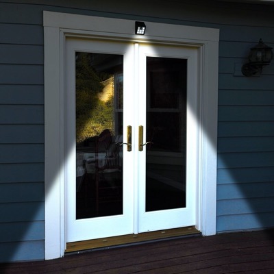 Motion sensor light overlooking a patio door